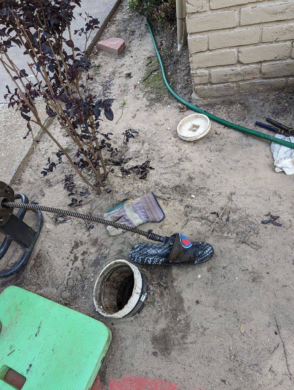 Drain cleaning equipment and a cleanout cap during a residential service call